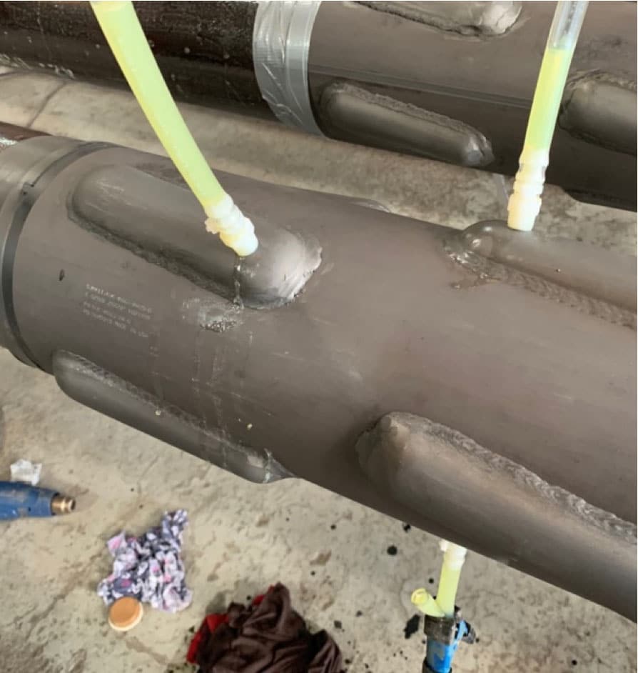 Pipes with hoses sticking out of them
